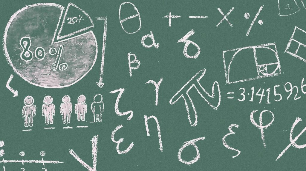 math symbols drawn with chalk on a blackboard